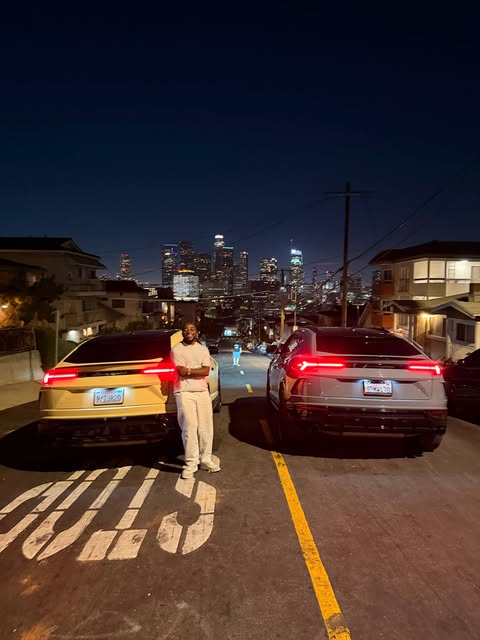 Ahmad Abdulaziz Yari in Los Angeles at night between two cars